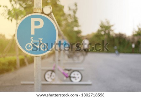 Bicycle sign, plate for bikes park in evening