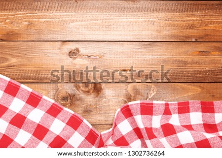 Red napkin on brown wooden table