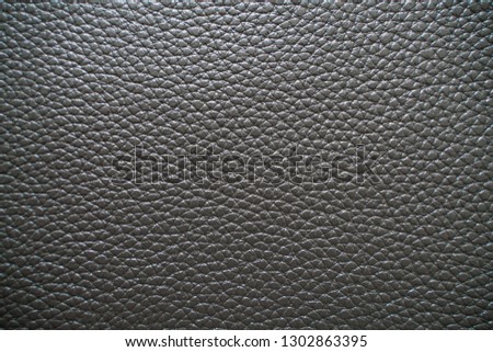 Genuine fullgrain black leather texture crafts background