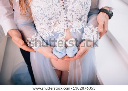 pregnant girl in a blue dress