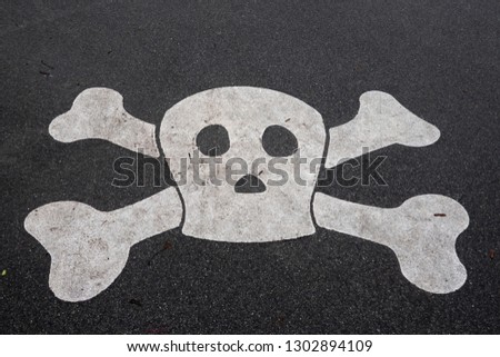 Pirate sign on asphalt road