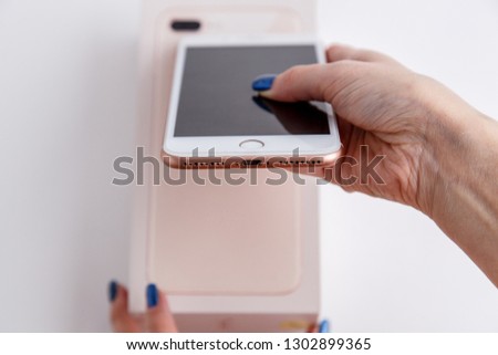Phone on a white background and in the hands