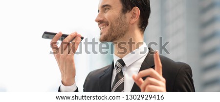 Attractive business man in suit using smart phone internet conferences, translated. Celebrated, Success people of the organization. The winner people customer service evaluation teamwork. 