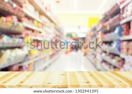 Blurred photo of products in shelf for shopping background.