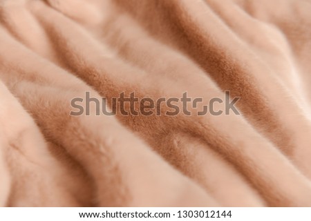 eco fur texture with beige close-up.