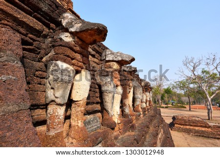The Ancient Elephants Stucco around the pagoda at Wat Chang Rob in Kamphaeng Phet Historical Park