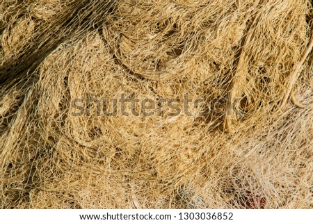 Pile of fishing net with cords and floats background.