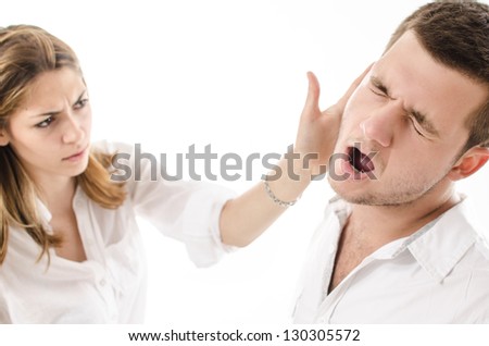 angry young woman slap boyfriend with her hand Royalty-Free Stock Photo #130305572