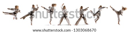 Caucasian female in kimono practicing taekwondo. Modern Korean martial art similar to karate Royalty-Free Stock Photo #1303068670