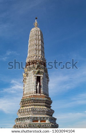 A pagoda tower in the Buddhist Temple of Dawn complex (Wat Arun) in Bangkok