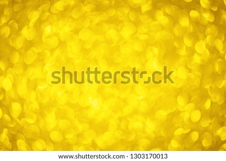 Gold Bokeh shape circle Mother's day yellow Background with Bright golden glitter Lights for Valentine's Day, 8 march or Women day. Studio shot.