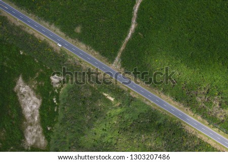 Top down road from traveling through frame diagonally 