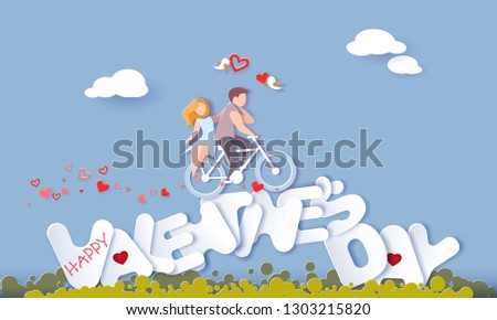 Happy Valentine's day card with couple riding bicycle over big letters on blue sky background. Vector paper art illustration. Paper cut and craft style.