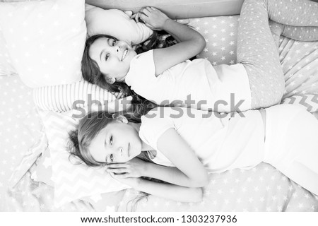 Girls just want to have fun. Invite friend for sleepover. Best friends forever. Consider theme slumber party. Slumber party timeless childhood tradition. Girls relaxing on bed. Slumber party concept.