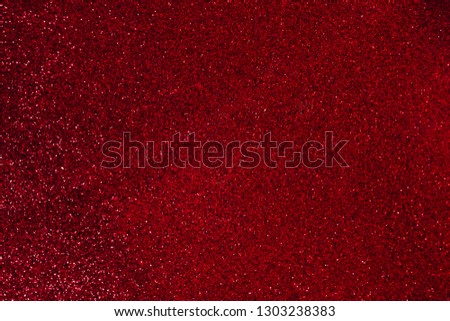 Texture of red glitter surface.