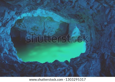 Tunnel in the rock. Blue light