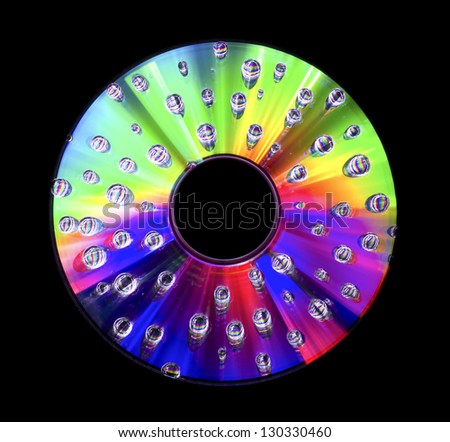 Abstract disc with water droplets isolated on black background
