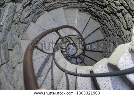 looking down the stairs in a old castle turret