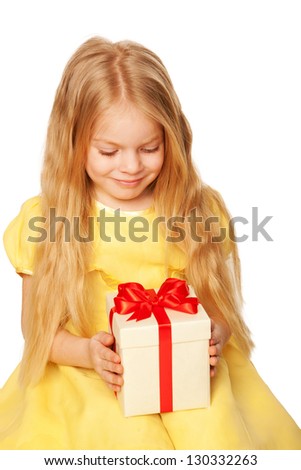 Pretty little girl enjoying gift. Festive concept. Isolated on white background