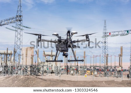 Drone flying and working for ortophoto and thermal analysis of PV Plants with visual and thermal camera. UAV are used for easy aerial inspections of Solar, Wind and Hydro renewable energy resources
 Royalty-Free Stock Photo #1303324546