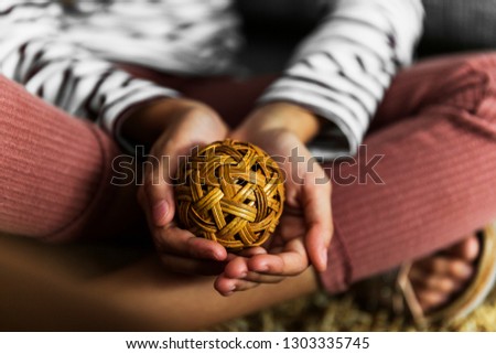 Young girl holding cane sphere for ultimate relaxation and attention grabbing tool and technique for all to use.