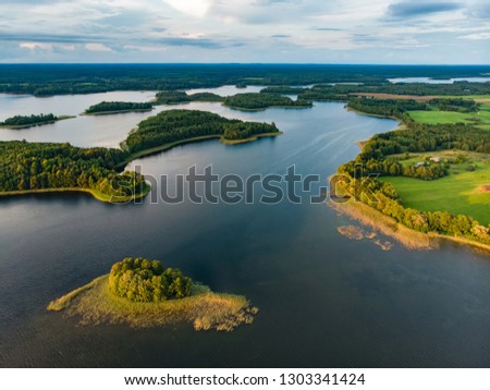 Beautiful aerial view of Moletai region, famous or its lakes. Scenic summer evening landscape, Moletai, Lithuania. Royalty-Free Stock Photo #1303341424