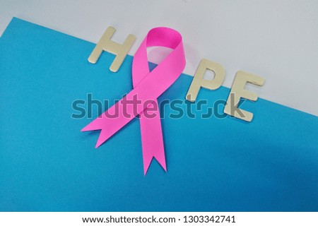 Hope sign with ribbon as breast cancer awareness poster template. Women health care support symbol. female hope satin emblem. Copy space for image or text.