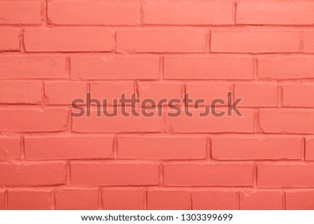 Color of the year 2019: Living Coral pantone brick wall background, copy space.