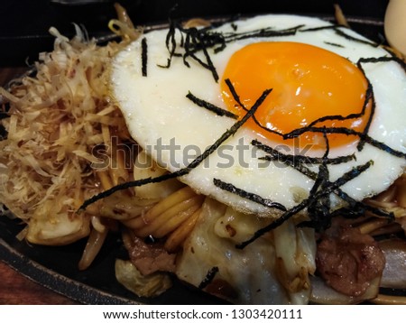 

Fried egg topped with seaweed