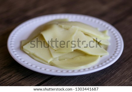 Bamboo shoots on wood background. Ready to cook. Royalty-Free Stock Photo #1303441687