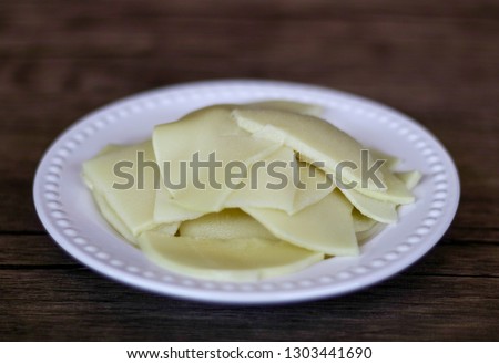 Bamboo shoots on wood background. Ready to cook. Royalty-Free Stock Photo #1303441690