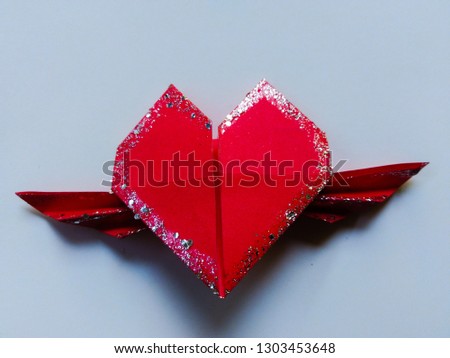 
Fold the red heart with wings