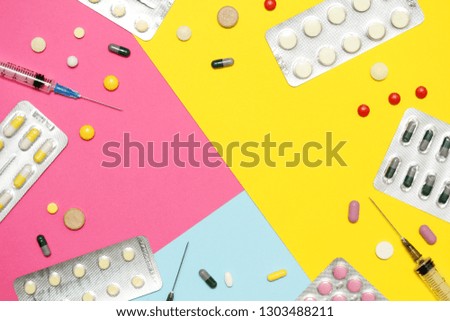 Bright background with copy space in the middle formed with different medication and pillows	