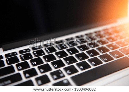 Close-up Laptop Keyboard with Flare focus Some keyboard characters