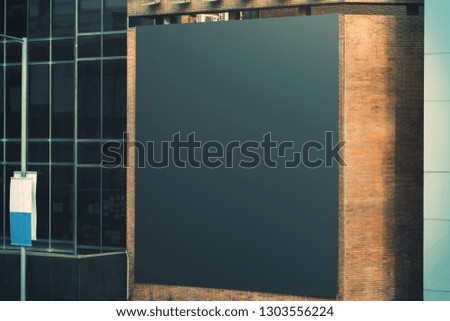Empty black bill board on building. Advertise concept. Mock up 