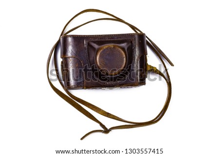 Vintage film photo camera in old leather case. Part of set.