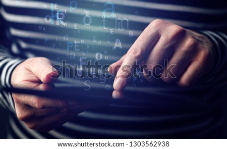 Electronic communication concept, hands of a woman using tablet computer to type an e-mail letter or blog and social media post, close up.digitally enhanced image