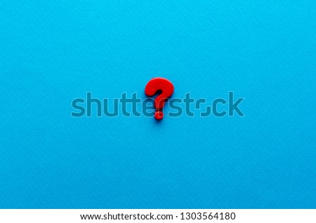 red question mark on blue background