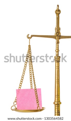 Golden weight balance scale with blank paper isolated on white background