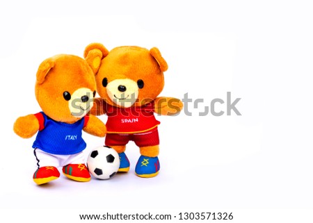 Teddy bear athlete Italy and Spain player with ball isolated on white background.