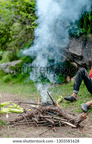Photo of Grilling Corn on Bonfire in Himalayas