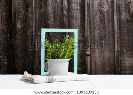 turquoise blue picture frame and lavender decoration at enamel mug