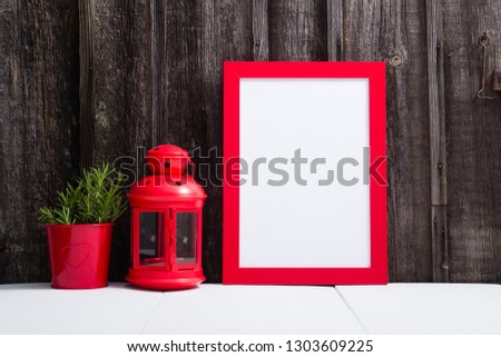 red picture frame blank, lantern, lavender decoration, white table, weathered wooden wall