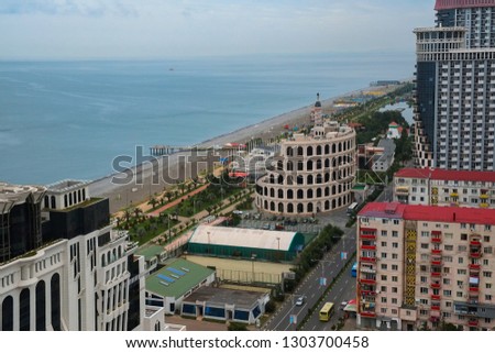Architecture of Batumi. Modern skyscrapers and skyline. View of the city under construction.