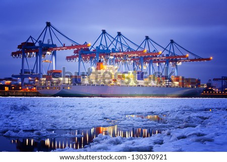 Container Terminal in Hamburg during winter.