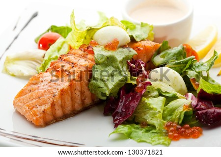 Grilled Salmon with Vegetables, Eggs and Sour Cream Sauce Royalty-Free Stock Photo #130371821