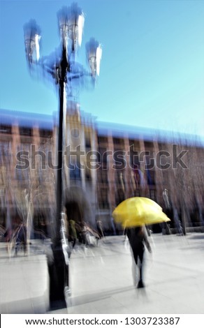 Tribute to Ernst Hass, Tribute to Monet, impressionist photograph of the photographic sweeps of ghostly human figures in Plaza Zocodover de Toledo, Spain, tour guides with yellow umbrellas, 
