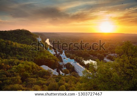 Sunset landscape. Holy Mountains and Sviatogorskaya Lavra at Sviatogorsk and Seversky Donets river.