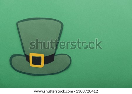 top view of paper hat isolated on green with copy space, st patrick day concept