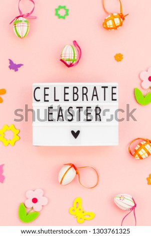 Creative Top view flat lay holiday composition Easter text on lightbox pink paper background copy space Template Easter day seasonal pattern